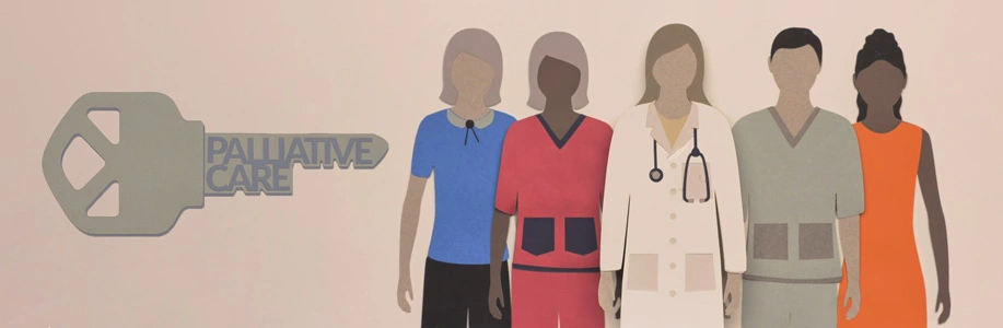 Giant key with "palliative care" written on it next to group of health providers