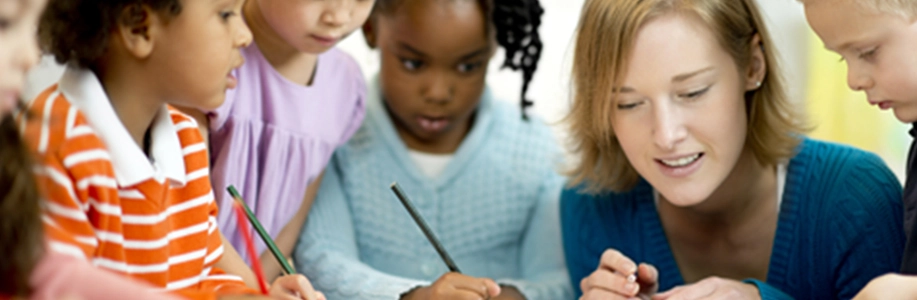 Teacher and three young students